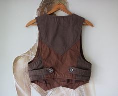 DIESEL Womens Vest Two Tone Brown Waistcoat M/L Size > Tag : Diesel > 100% Cotton > Lining : 100% Polyester > Label size is L, but looks smaller, see measurements NOTE : Actual colors may vary. This is due to the fact that each monitor has different possibilities for displaying colors and that everyone sees these colors in their own way. Great Vintage Condition Measurements (laying flat) : Length : 46 cm / 18.1'' (front) Length : 38 cm / 15'' (back) Armpit to armpit : 42 cm / 16.5'' Brown Cotton Vest With Button Closure, Brown Utility Vest For Fall, Brown Cotton Vest Outerwear, Fitted Patchwork Vest For Fall, Brown Cotton Vest For Fall, Brown Cotton Vest With Buttons, Fitted Cotton Vest Outerwear, Brown Cotton Outerwear For Layering, Fitted Utility Vest For Workwear