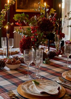 the table is set with place settings for dinner