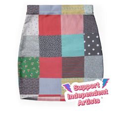 a skirt made out of patchwork fabric with the words support independent artists on it