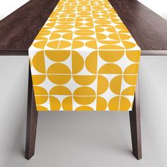 a long table with a yellow and white design on it