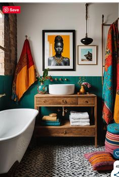 a bathroom with a sink, mirror and bathtub next to a painting on the wall