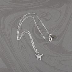 This beautiful crystal butterfly necklace is made with a dainty silver-plated crystal encrusted butterfly pendant and is suspended on a sterling silver chain with a sterling silver clasp. The necklace is available in five necklace lengths, please choose the necklace length you need from the drop-down menu. The necklace will arrive in an attractive gift box. Elegant Silver Butterfly Necklace In Sterling Silver, Silver Minimalist Butterfly Necklace With Adjustable Chain, Delicate Silver Butterfly Necklace With Clavicle Chain, Minimalist Sterling Silver Butterfly Necklace With Clavicle Chain, Silver Butterfly Necklace With Delicate Sterling Chain, Silver Sterling Butterfly Necklace With Clavicle Chain, Delicate Silver Sterling Silver Butterfly Necklace, Delicate Sterling Silver Butterfly Necklace, Elegant Silver Butterfly Necklace With Delicate Chain