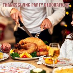 a man cutting a turkey on top of a table