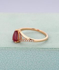 Ruby engagement ring in rose goldPear shaped wedding | Etsy Fine Jewelry Pear-shaped Ruby Ring With Diamond, Pear-shaped Ruby Diamond Ring With Prong Setting, Diamond Ruby Ring With Prong Setting In Pear Shape, Pear-shaped Ruby Ring With Diamond, Formal Ruby Ring With Brilliant Cut Moissanite, Formal Moissanite Ruby Ring With Brilliant Cut, Heirloom Teardrop Diamond Ring For Formal Occasions, Formal Brilliant Cut Moissanite Ruby Ring, Formal Heirloom Teardrop Diamond Ring