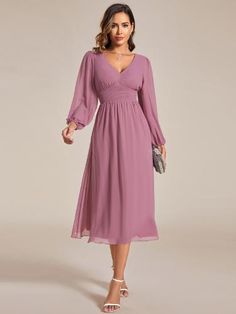 Step into any cocktail party or special event with confidence in this stunning Chiffon V-Neck Long Sleeves Elastic Band Midi Dress. The combination of the flowing chiffon fabric, v-neckline, and long sleeves exudes a classy and refined vibe. Complete your look with heels and accessories for a memorable appearance that will turn heads all night long. Solid V-neck Chiffon Dress, V-neck Chiffon Dress With Ruched Bodice, Flowy Chiffon V-neck Dress For Party, Solid Chiffon V-neck Dress, Flowy Solid Chiffon V-neck Dress, Flowy Solid Chiffon Dress With V-neck, Solid Color Flowy V-neck Chiffon Dress, Flowy Long Sleeve Chiffon Dress For Formal Events, Flowy Long Sleeve Chiffon Dress For Wedding Guest