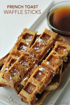 french toast waffle sticks on a white plate with syrup in the background and text overlay that reads, french toast waffle sticks