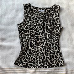 Brand New With Tags Cheetah/Leopard Print Sleeveless Stretchy Blouse - Perfect To Pair Under Blazers! 95% Polyester 5% Spandex Stretch Sleeveless Leopard Print Top, Calvin Klein Summer Tank Top, Calvin Klein Fitted Summer Tank Top, Calvin Klein Fitted Tank Top For Summer, Chic Leopard Print Sleeveless Top, Calvin Klein Fitted Sleeveless Tank Top, Casual Sleeveless Leopard Print Top, Calvin Klein Black, Womens Calvin Klein