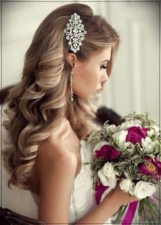 a woman in a wedding dress holding a bouquet