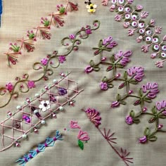 several different types of embroidered flowers and vines