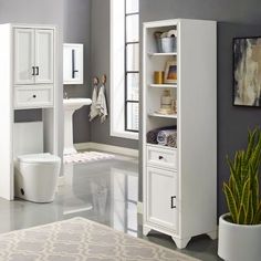 a white bathroom with gray walls and flooring