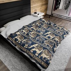 a bed with an elephant design on it