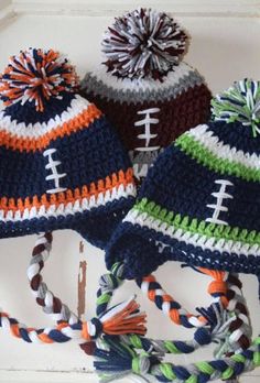 three knitted hats with footballs on them