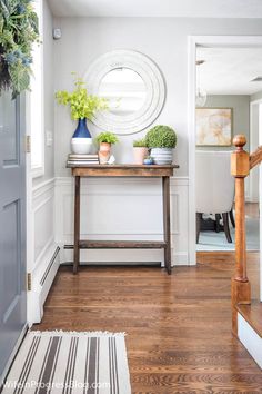 the entryway is clean and ready to be used as a place for flowers or plants