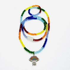 a multicolored beaded necklace with an elephant charm