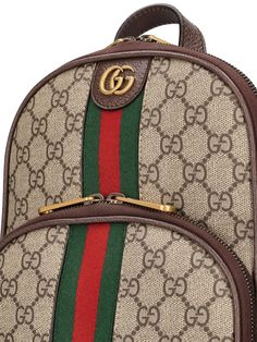 Height: 29cm Width: 20cm Depth: 5cm. Detachable adjustable strap. Single top handle. Zip closure. Front metal logo. Web detail. All over GG pattern placement may vary. Leather trim. Gold-colored metal hardware. One front zip pocket Designer Gucci Backpack With Zipper Closure, Gucci Luxury Backpack With Zipper Closure, Gucci Crossbody Bag With Logo, Classic Gucci Bag With Logo Hardware, Gucci Brown Standard Backpack, Gucci Brown Backpack For Daily Use, Brown Gucci Standard Backpack, Monogram Canvas Bag With Logo Hardware For Travel, Luxury Bags With Logo For On-the-go