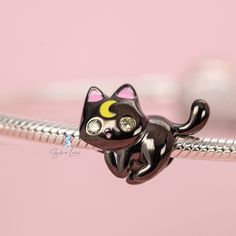 This is charm only, bracelet is sold separately. This cute Luna cat charm features a black cat design with a gold moon on forehead, made of solid 925 sterling silver with black gold metallic plated. Add this cute lunar cat bead charm to your existing charm bracelet or as gift for your love one. Add a touch of whimsy and mystery to your charm bracelet with the Lunar black cat charm! Crafted with high-quality sterling silver and adorned with a stunning gold moon, this unique and stylish charm is p Cute Black Jewelry With Charms, Black Jewelry With Removable Charms For Gifts, Black Sterling Silver Charm Bracelet As Gift, Moon On Forehead, Luna Cat, Black Cat Design, Cat Bead, A Black Cat, Cat Charm