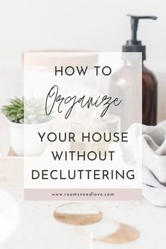 a bathroom counter with towels and soaps on it that says how to organize your house without decluttering