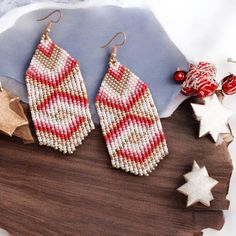 This red and white beaded fringe earrings are made of seed beads, silver plated ear hooks, nylon thread, silicon plugs. All the color fit perfectly and give a mesmerizing look that fits every outfit! Fringe earrings size: The full length of earrings with hook is 3.5 inches approximately. Please contact me if you want these earrings in another size. - Please follow my Esty Page - Follow me on Instagram for updates on new designs and collections @mannat_designco - Follow me on Facebook @MannatDesignCo Festive White Beaded Earrings With Dangling Beads, Festive White Dangling Beaded Earrings, Festive White Beaded Dangling Earrings, Christmas Red Beaded Earrings With Colorful Beads, Festive Red Beaded Chandelier Earrings, Red And White Seed Bead Earrings, Red Beaded Fringe Earrings, Santa Fringe Earrings, Christmas Party Earrings