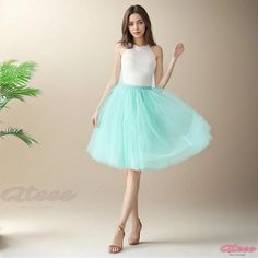 Qteee - Layered Tulle Skirt with Mesh Overlay and Flared Bottom Green Wedding Skirt For Spring, Green Spring Wedding Skirt, Spring Wedding Green Skirt, Fitted Green Petticoat For Spring, Fitted Green Petticoat For Summer, Green Summer Wedding Skirt, Silhouette Mint, Tulle Midi Skirt, Layered Tulle Skirt