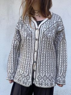 Beautiful vintage handmade woolen cardigan from Norway Taupe pattern, soft light colors, metallic buttons, oversized fit Very warm and cozy  Excellent vintage condition  100% wool No tags   (modeled on M, 172cm)   Measurements:  Shoulders - 60cm(23,6") Underarms- 57cm(22,5") Length - 78cm(31") Handmade Cream Cardigan For Winter, Scandinavian Style Fair Isle Cardigan For Fall, Nordic Style Knitted Cardigan For Fall, Nordic Style Long Sleeve Knitted Cardigan, Bohemian Winter Cardigan With Buttons, Winter Handmade Beige Cardigan, Bohemian Winter Sweater With Buttons, Handmade Beige Cardigan For Winter, Winter Beige Handmade Cardigan