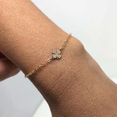 Make your own luck! Small 14k gold fill four leaf clover charm attaches to 14k gold fill chain to make this simple and charming bracelet. Clover measures 1/4 of an inch. Sterling silver and rose gold fill options also available. This is a great piece alone or to layer. LENGTH - Bracelet on the model is 6.5 inches long. YOUR ORDER - Choose either gold fill, rose god fill, or sterling silver in the drop-down menu. - Select the length in the drop-down menu. - You can select expedited shipping at ch Dainty Rose Gold Charm Bracelet, Dainty Rose Gold Tarnish Resistant Charm Bracelet, Dainty 14k Gold Bracelet With Charms, Bracelet Clover, Make Your Own Luck, Four Leaf Clover Bracelet, Charming Bracelet, Four Leaf Clover Charm, Clover Bracelet