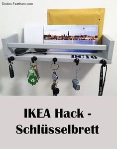 there is a key rack with keys hanging from it and the words ikea hack - schlusselbrett