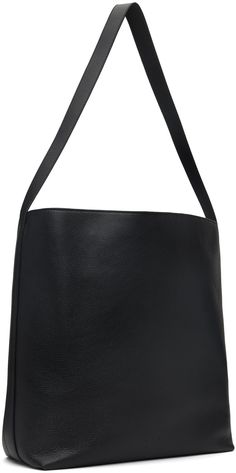 Grained calfskin tote in black. · Fixed shoulder strap · Logo embossed at face · Magnetic closure · Patch pocket at interior · Faille lining · H13 x W16 x D5 Supplier color: Grain black Elegant Black Bucket Bag With Smooth Grain, Sleek Calf Leather Shoulder Bag For Everyday Use, Black Smooth Grain Bucket Bag, Structured Leather Bucket Bag, Black Calf Leather Shoulder Bag With Smooth Grain, Business Hobo Bag In Calf Leather, Sleek Textured Leather Shoulder Bag For Work, Black Textured Leather Structured Shoulder Bag, Black Structured Textured Leather Shoulder Bag