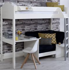 a white loft bed sitting next to a desk with a laptop on top of it