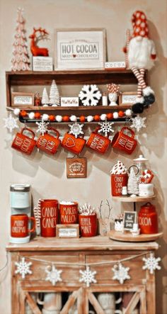 a shelf filled with red and white christmas decorations