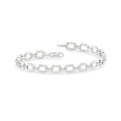 Intertwined in timeless elegance, this bracelet features a trail of sleek diamond links, embodying modern luxury. With its simple, yet contemporary design, it is the perfect addition to any ensemble. Together forever, this bracelet is a symbol of everlasting love and commitment. Modern Jubilee Link Bracelet, Classic Link Chain Tennis Bracelet, Modern Jubilee Bracelet With Chain Link, Modern Sterling Silver Jubilee Bracelet With Rectangular Links, Modern Link Chain Bracelet For Formal Occasions, Classic Chain Tennis Bracelet, Modern White Gold Paperclip Bracelet, Anniversary Diamond Bracelet With Rectangular Links, Modern Diamond Cut Bracelet For Anniversary