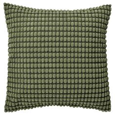 a green pillow on a white background