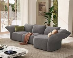 a living room with a large gray couch