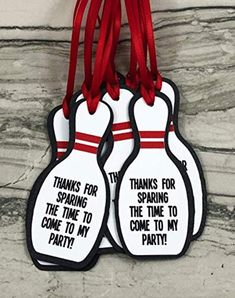 two bowling pins hanging from a red ribbon with thank for sparkling the time to come to my party