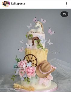 a cake decorated with flowers and a horse on top