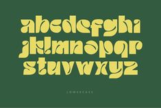 the upper and lower case of an old fashioned font with yellow letters on green background