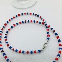 "This beadwork project is a design that is made on Accuflex beading wire. This necklace measures 22\".  If you would like this necklace done in a different size or colors, let me know and I'll set up a listing for that.  You are purchasing this actual beaded necklace. These are great layered with your other necklaces.  Let me personalize some especially for you in your school colors. This could be the colors of your High School." Patriotic White Jewelry With Colorful Beads, Patriotic Round Beads Necklace As Gift, Patriotic Round Beads Necklace Gift, Red Patriotic Necklace For 4th Of July, Adjustable Blue Patriotic Necklace, Patriotic Blue Beaded Necklaces, Blue Beaded Necklaces For 4th Of July, Patriotic Beaded Necklace For Gift, Adjustable Patriotic Red Necklace