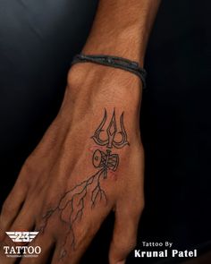 a man's hand with a tattoo on it