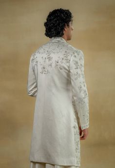 Editor's Note Featuring our work of art in our white all-over hand-embroidered sherwani set. The foundation is crafted using tone-on-tone thread along with silver zari work as a base texture. Fabric: Linen silk Color: White Components: Sherwani, kurta, churidar Occasion: Groom Fit: Regular Note: Product colour may slightly vary due to photographic lighting sources Care: Dry clean only About the Designer After establishing himself as the leading couturier in the industry of menswear, Jatin Malik Manpreet Toor, Jatin Malik, White Sherwani, Embroidered Sherwani, Blouse Yoke, Dhoti Pants, Texture Fabric, Royal Look, Haldi Ceremony