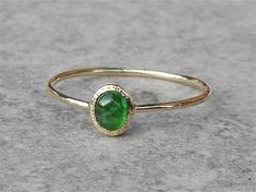 Natural emerald ring handcrafted in 14k Yellow Gold, dainty emerald ring, emerald engagement ring. The emerald in this ring is natural gemstone, Earth mined, not synthetic or lab created. The emerald is bezel set and the mounting around the stone is hammered. APPROXIMATE MEASUREMENTS OF THE RING: *Emerald with setting measure: 5.3mm X 4.8mm *The band is approximately 1mm wide. *material: 14k yellow gold *size: this ring is made to order in YOUR size, please choose your size from drop down menu. Emerald Ring Engagement, Gold Emerald Ring, Smaragd Ring, Pink Morganite Engagement Ring, Green Gemstone Ring, Natural Emerald Rings, Bezel Engagement Ring, Emerald Ring Gold, Natural Gemstone Ring