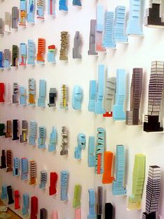 there are many toothbrushes hanging on the wall