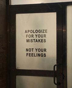 a sign that is on the side of a door saying, apoloize for your mistakes not your feelings