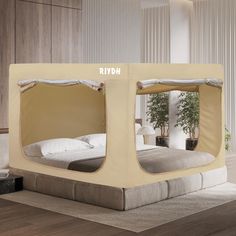 a bed that is made to look like it has been set up in the shape of a tent