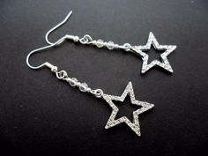 This a pair of cute crystal star themed earrings with 925 solid silver hooks. Measure approx. 5cm from top of hook to bottom of earring. Freshly made by me and unworn. Thanks for looking!! Dangling Star Earrings, Sparkling Star Crystal Earrings For Party, Silver Star Charm Crystal Earrings For Gift, Silver Star Crystal Earrings For Pierced Ears, Silver Star Crystal Earrings, Silver Star Dangle Earrings, Silver Star-shaped Crystal Earrings For Party, Silver Star-shaped Crystal Earrings For Pierced Ears, Elegant Star-shaped Sparkling Crystal Earrings