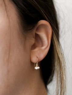 𝗘𝗮𝘀𝘆 𝗧𝗼 𝗦𝘁𝘆𝗹𝗲, 𝗠𝗮𝗱𝗲 𝗧𝗼 𝗟𝗮𝘀𝘁 Our dainty freshwater pearl earrings are easy to pair and ready to be worn on repeat! Created to last a lifetime, these earrings will remain evergreen even as the years and trends come and go. 𝗠𝗮𝘁𝗲𝗿𝗶𝗮𝗹𝘀 𝗪𝗲 𝗨𝘀𝗲 These drop earrings are made entirely with sturdy 14k yellow gold filled or sterling silver pieces. They are safe to wear in the shower, but we recommend avoiding prolonged exposure to chemicals like chlorine to keep your earrings like new! These earrings are made with genuine pearls! They are not dyed and will not lose their color over time. 𝗠𝗼𝗿𝗲 𝗗𝗲𝘁𝗮𝗶𝗹𝘀 -Pearls measure 3mm -Comes with standard earring backs 𝗘𝘅𝘁𝗿𝗮𝘀 𝗮𝗻𝗱 𝗔𝗱𝗱 𝗢𝗻𝘀 Gift Box This gift box has a velour interior and features a sliding d Everyday Teardrop Earrings With Pearl Charm, Delicate Everyday Pearl Drop Earrings, Delicate Everyday Earrings With Pearl Charm, Delicate Everyday Pearl Charm Earrings, Delicate Pearl Charm Earrings For Everyday, Minimalist Pearl Drop Earrings For Everyday, Everyday Drop Pearl Earrings For Pierced Ears, Everyday Drop Earrings With Pearl Charm, Dangle Earrings With Pearl Charm For Everyday