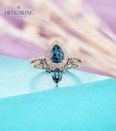 "This ring in yellow gold: https://www.etsy.com/listing/1213374057 ≫Item Details Made to Order, All Handmade in the United States. Metal: Solid 14K & 18K Gold Gold Color: White gold, Rose gold, Yellow gold 1) Engagement ring Main Stone: London Blue Topaz Size: 7*5mm Shape: Pear cut Moissanite / Diamond Shape: 1.3mm&1.2mm Round cut Carat: about 0.298ct Color: DEF(moissanite)/G-H(diamond) Clarity: VVS-VS(moissanite)/VS-SI(diamond) Ring head size: 10.7*8.4mm Ring head height: 5.5mm Band width: 1.2m Pear Shaped London Blue Topaz Ring Halo, Teardrop Engagement Ring Blue Nile, Luxury Teardrop Topaz Ring For Formal Occasions, Luxury Elegant Teardrop Topaz Ring, Luxury Yellow Gold Pear-shaped Topaz Ring, Luxury Pear-shaped Topaz Ring For Wedding, Luxury Pear-shaped Yellow Gold Topaz Ring, Luxury Pear-shaped Topaz Ring In Fine Jewelry Style, Luxury Pear-shaped Topaz Wedding Ring