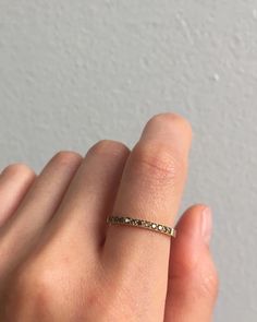 When people ask us for suggestions on bands to pair with existing pieces, we always go back to this beauty. Warm champagne diamonds really add warmth to your assortment, and while feeling a bit vintage, this piece mixes well with modern pieces because of its clean design.