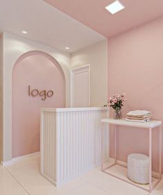 a pink and white room with a sign that says logo on the wall next to it