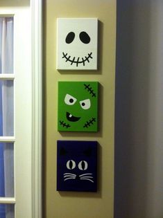 halloween canvases silly spooky faces ghost and frankenstein cat painted on the wall