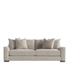 an image of a couch with pillows on it's back and the seat upholstered