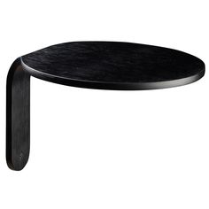 a black table with an oval shaped top